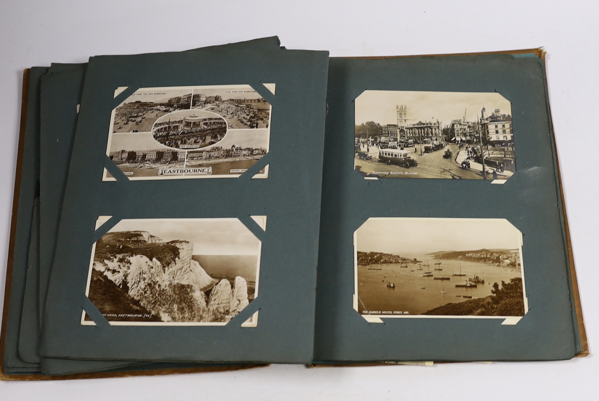 A postcard album and various early 20th century postcards